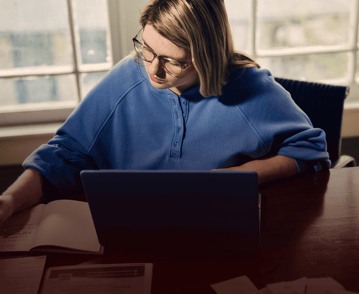 Woman with narcolepsy type 1 studying at her desk