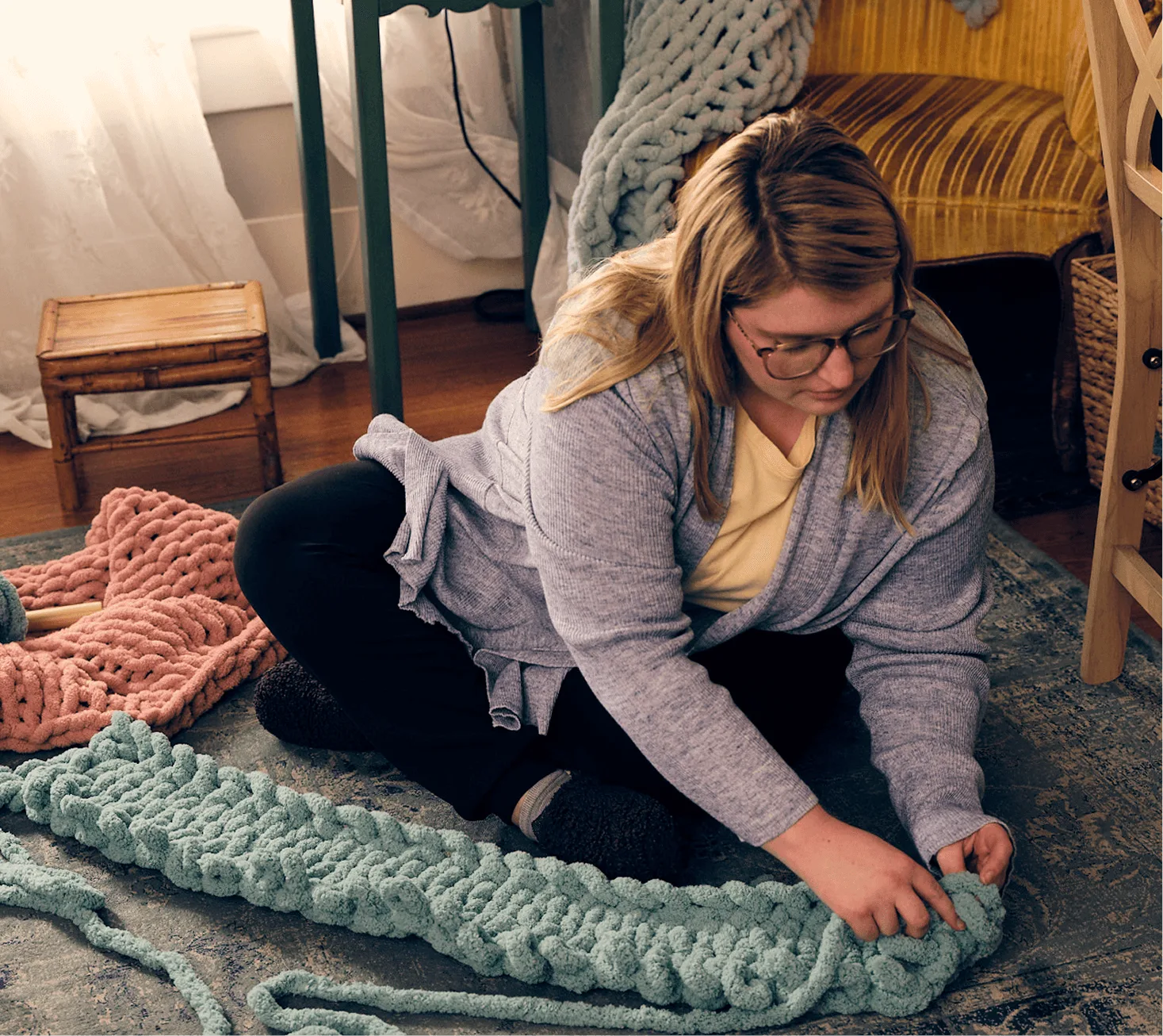 Woman with narcolepsy type 1 sitting on the floor and hand knitting